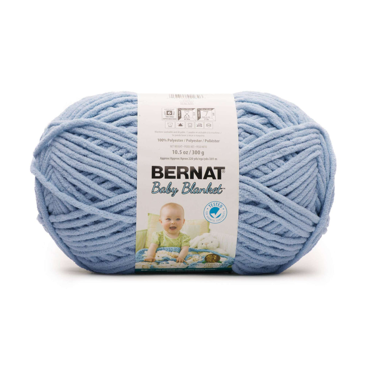 Blue ball of yarn with a Bernat Baby Blanket label on a white background