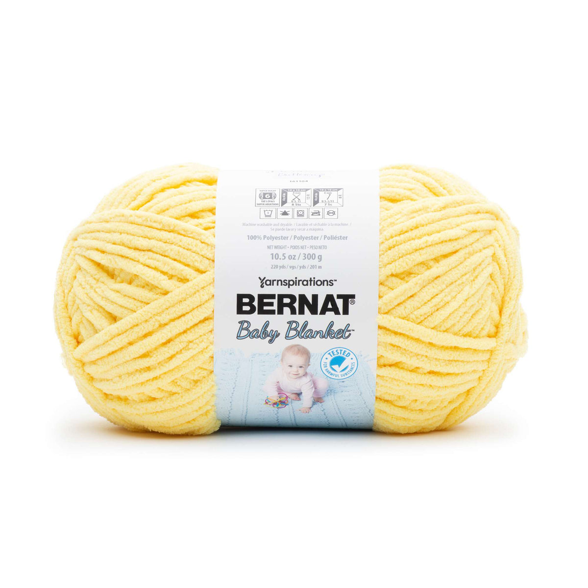 Ball of yellow yarn with Bernat Baby Blanket label on a white background