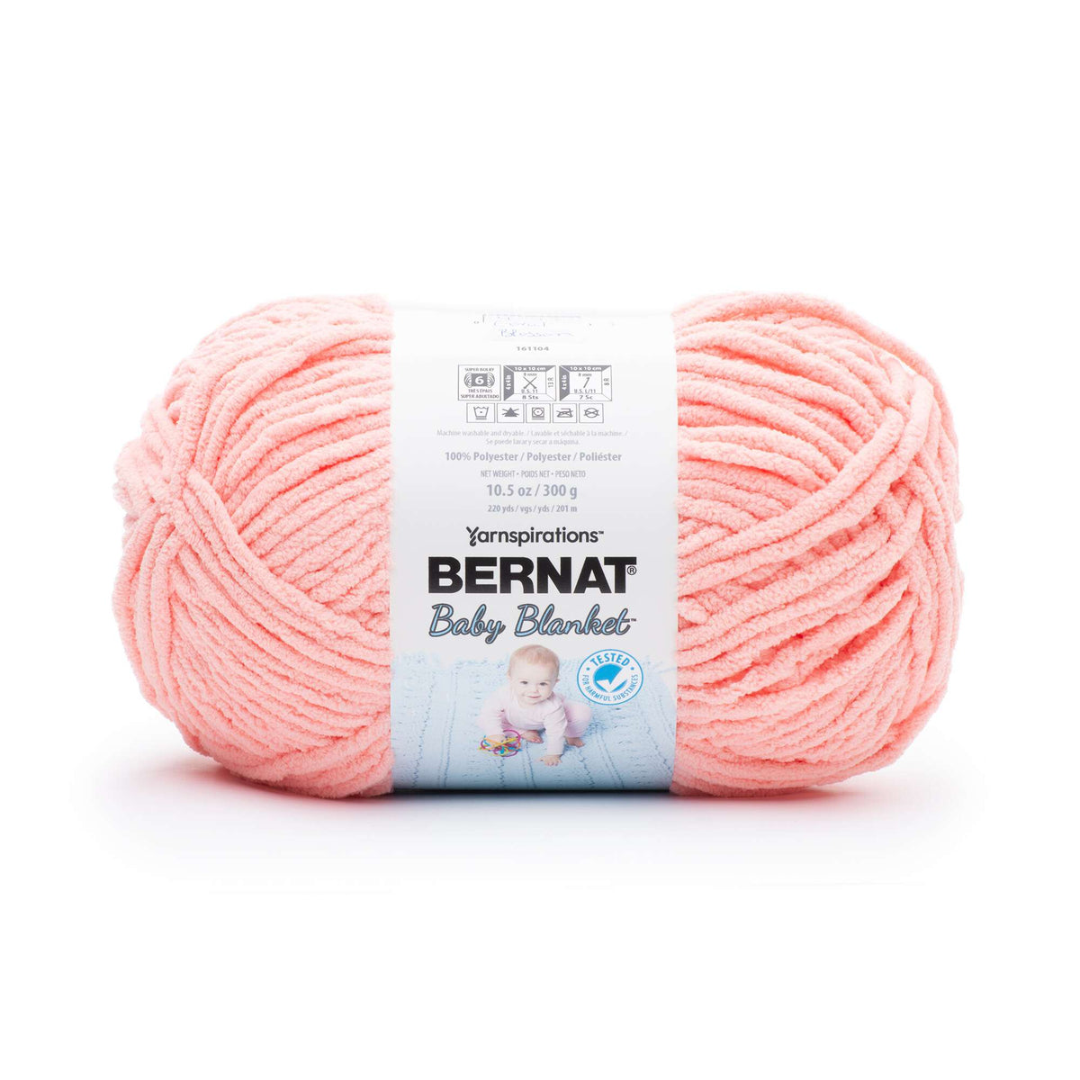 Ball of coral yarn with a Bernat label on a white background