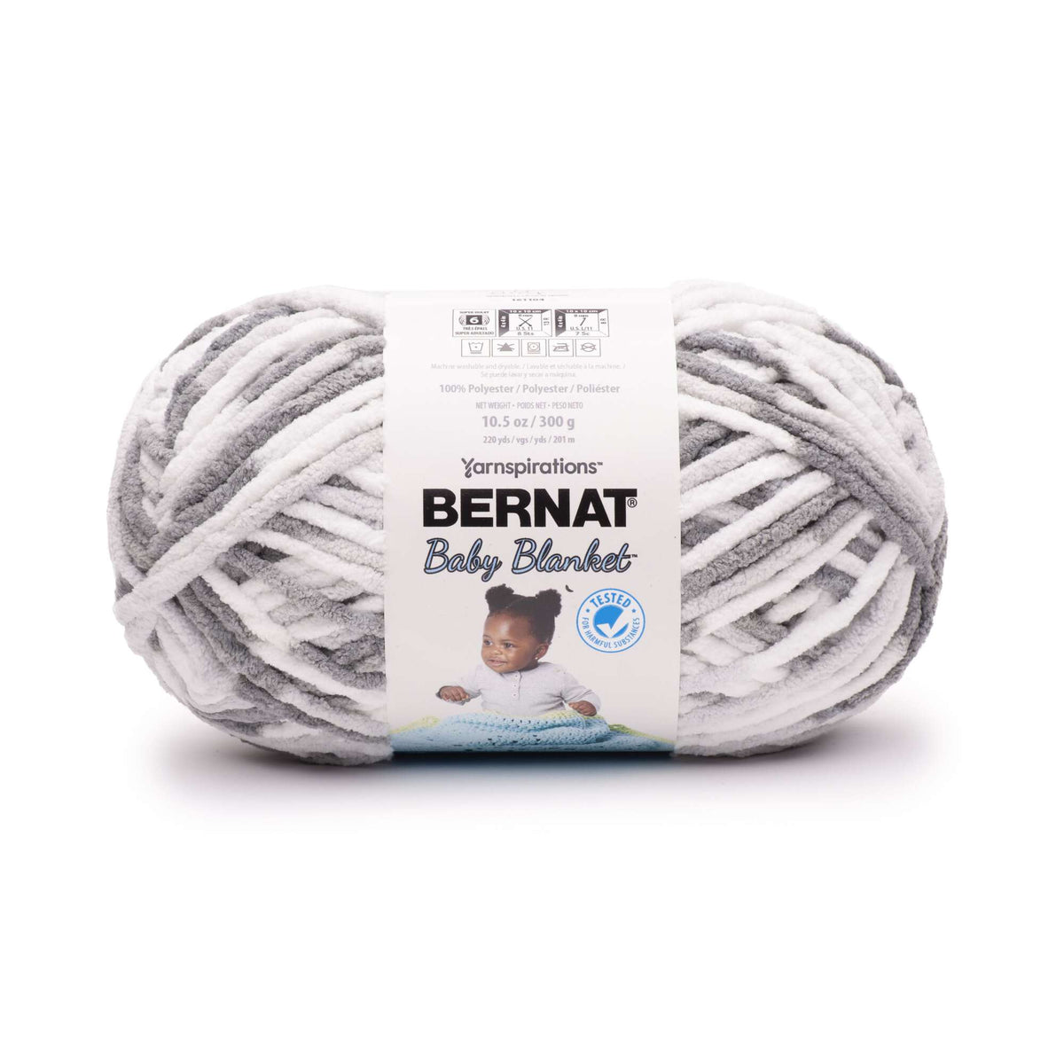 Ball of Bernat Baby Blanket yarn with label on a white background