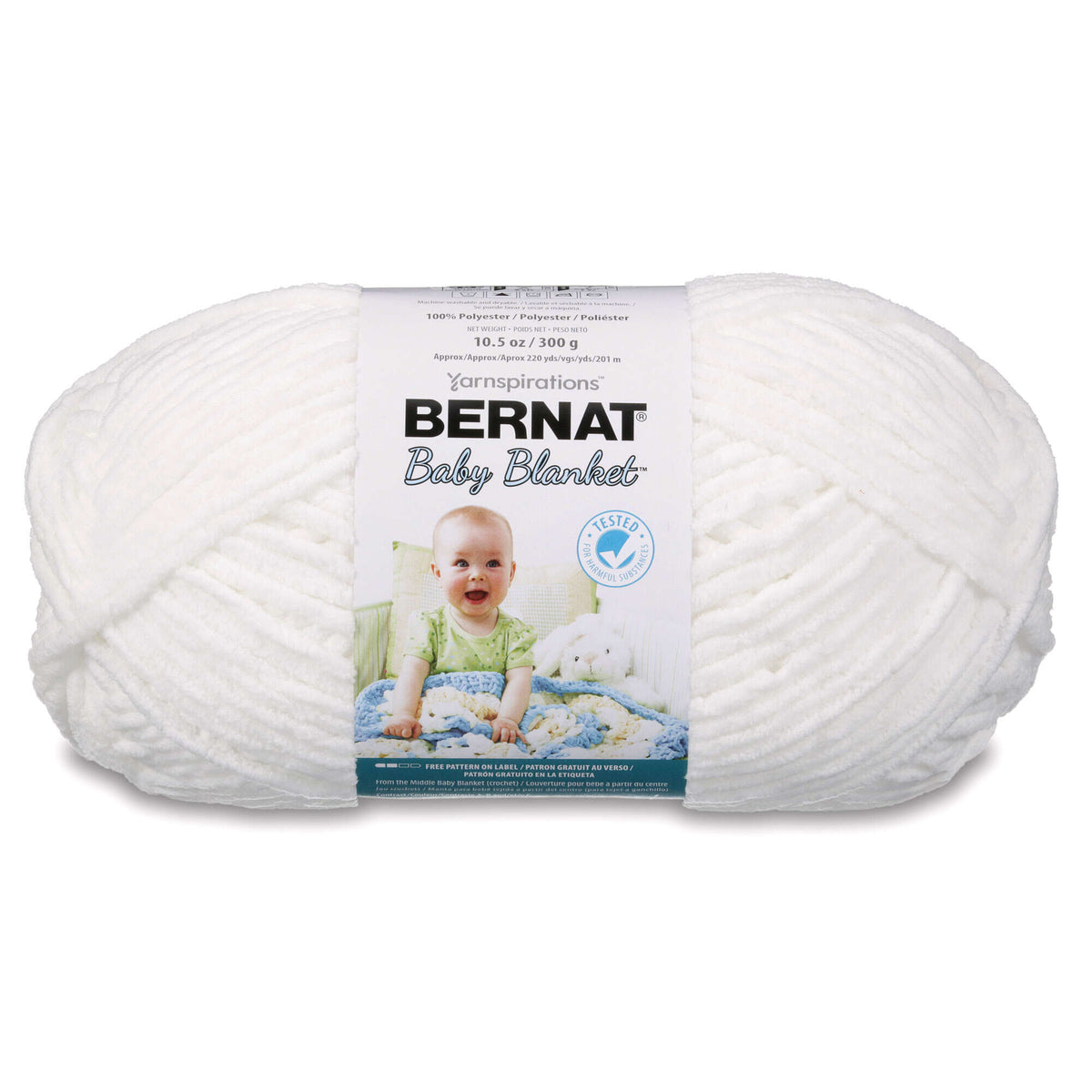 Ball of white Bernat Baby Blanket yarn with packaging on a white background